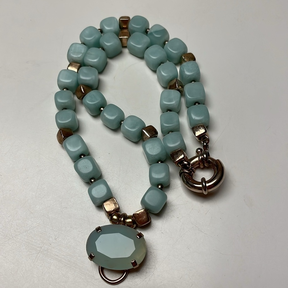 Necklace with gold-like inserts.